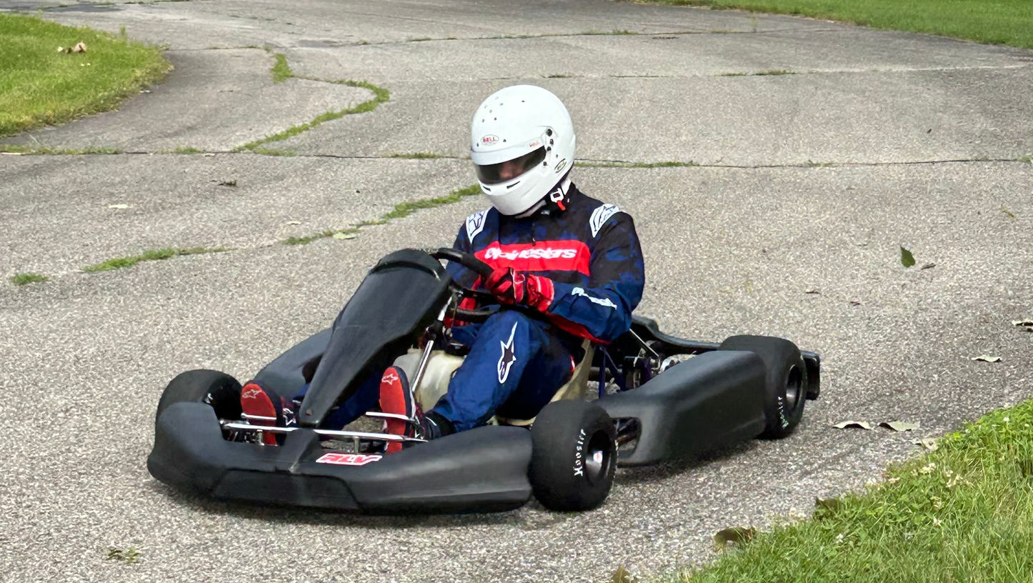 Owen Neisel racing go-kart on track