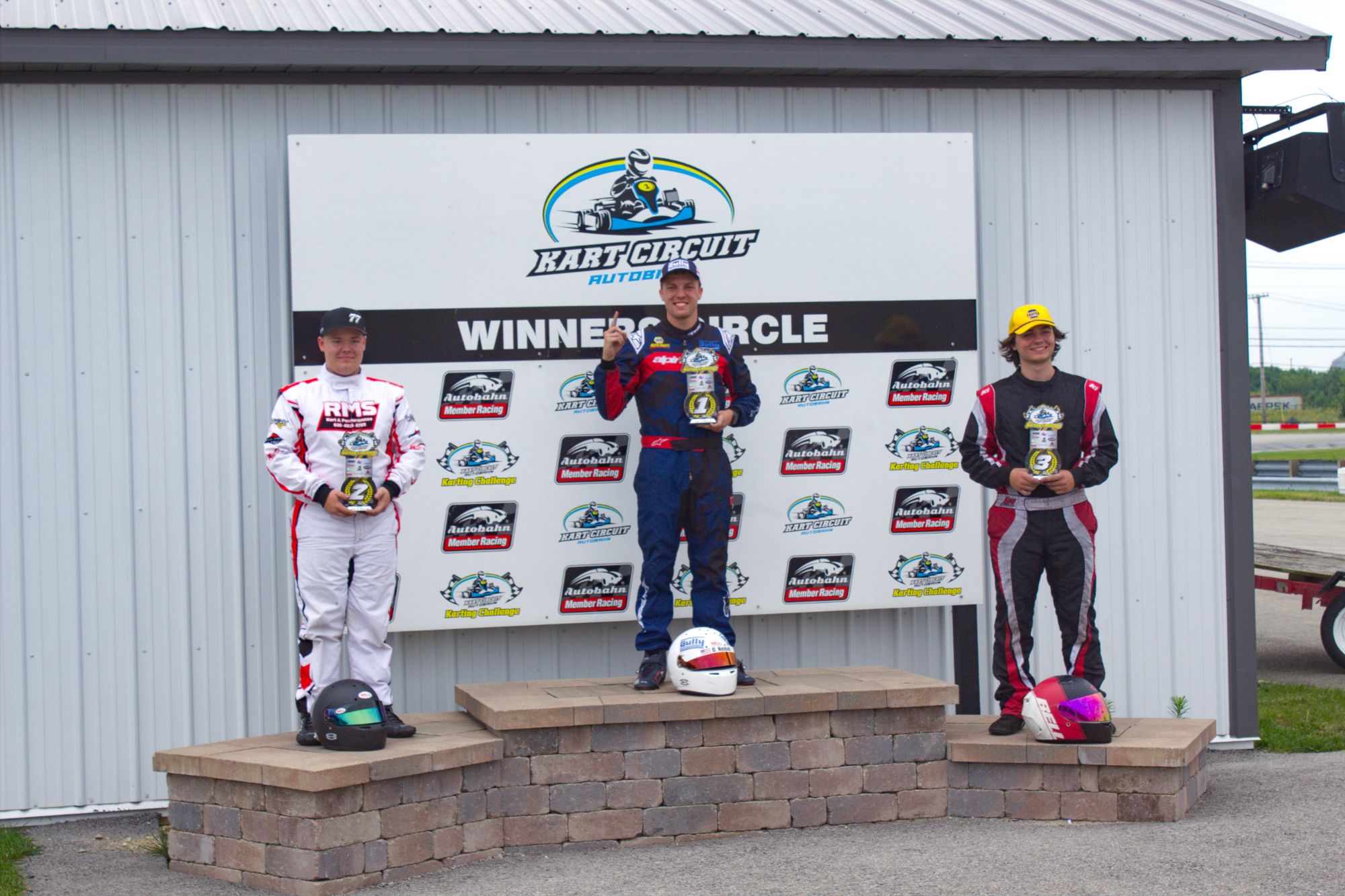 Owen Neisel on top of the podium in Winners Circle after his Round 3 win